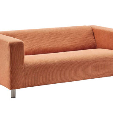 Comfortable sofa made of fabric. Minimalist rectangular sofa. White background.
