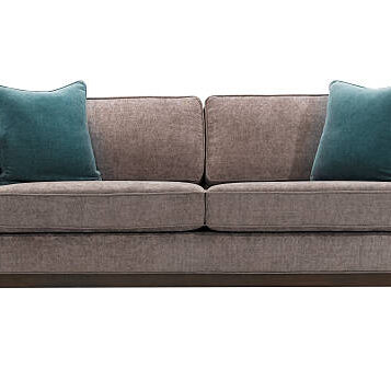 Grey sofa and blue pillows isolated with clipping mask.